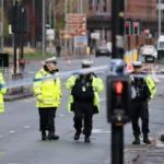 Police Sergeant Crushed by Reversing Car in Manchester; Man Held