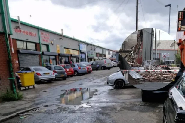 Bury New Road fire destroys the Marc Darcy showroom in Salford as crews tackle hotspots, roads remain closed and police investigate the scene.