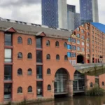 Ancoats Canal dog rescue strangers lower man over water edge