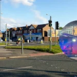 Chorlton flat fire Man arrested after windows explode 2026