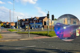 Chorlton flat fire Man arrested after windows explode 2026