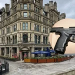 Manchester police seize £70,000 and gun in gang-linked raids