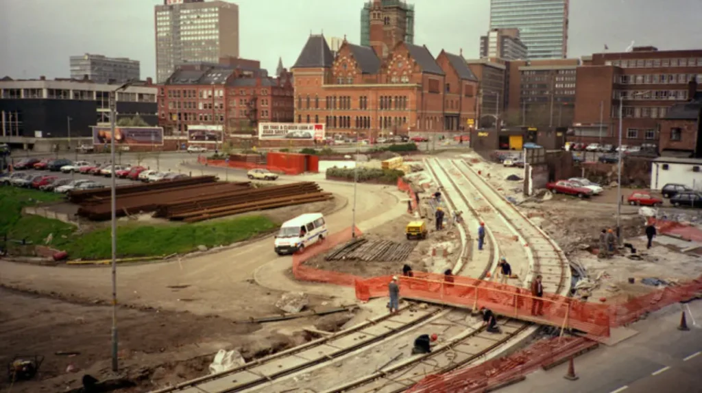 How does the Metrolink tram network connect Manchester to Altrincham?